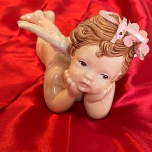 Vintage Ceramic Angel Cherub On his Belly with Flowers and ribbon bow in hair